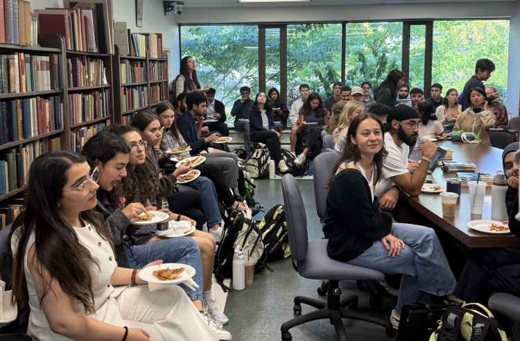 students sitting in a crowd facing a presenter